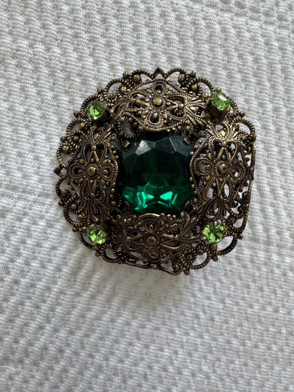 Vintage-Style Bronze Filigree Brooch with Emerald Green Stones